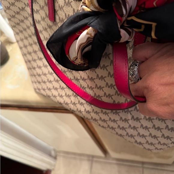 Michael Kors tote 19 length 11 wide zippered closures outside and out. 3 inside - Picture 6 of 11